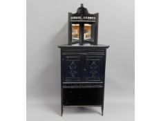 An ebonised Edwardian corner cabinet, 57.75in high