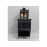 An ebonised Edwardian corner cabinet, 57.75in high