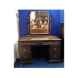 A mid 20thC. oak dressing table, 59.5in high x 46i