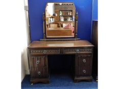 A mid 20thC. oak dressing table, 59.5in high x 46i