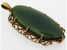 A 9ct gold mounted jade pendant, 53.5mm high, 9.2g