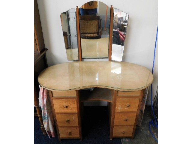 A post war utility kidney shaped dressing table wi