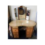 A post war utility kidney shaped dressing table wi