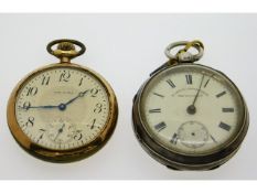 A gold plated Waltham pocket watch twinned with a
