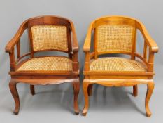 Two cane seated arm chairs. 34.5in high to back, 2