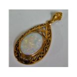 A yellow metal pendant, tests as 10ct gold, set wi