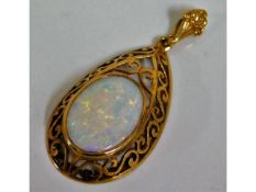 A yellow metal pendant, tests as 10ct gold, set wi