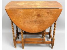 A 1920's oak drop leaf table, 30.5in wide x 28.5in high x 43in extended