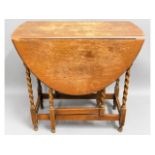 A 1920's oak drop leaf table, 30.5in wide x 28.5in high x 43in extended