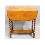 A 1920's oak barley twist drop leaf table, 28in hi