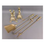 A brass companion & fire dog set