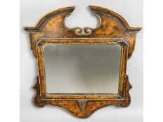 An 18thC. gesso framed mirror, carved crest to rea