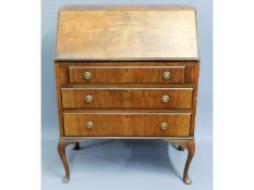 An early 20thC. mahogany bureau, 38in high x 29.25