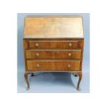 An early 20thC. mahogany bureau, 38in high x 29.25