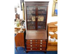 A 19thC. mahogany bureau bookcase, 84in high x 35.