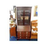 A 19thC. mahogany bureau bookcase, 84in high x 35.