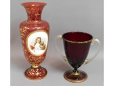 A large 19thC. Bohemian cranberry coloured vase wi