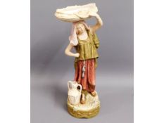 A Royal Dux figure depicting woman carrying basket