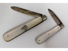 Two silver bladed fruit knives, one fails to close