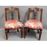 A pair of decorative, upholstered hall chairs