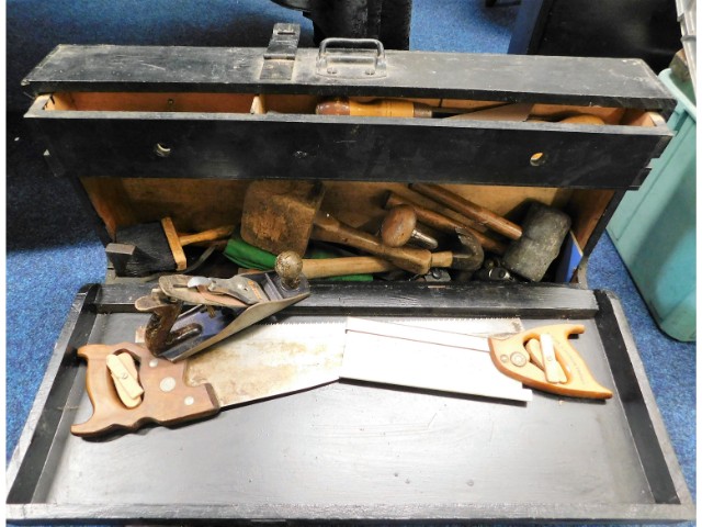 A carpenters tool case with tools including saws &