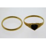 A 9ct gold band size N/O twinned with a 9ct gold h