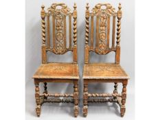 A pair of Victorian oak hall chairs, finial loss o