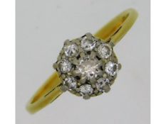 An antique 18ct gold (rubbed mark) daisy ring of a