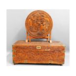 An early 20thC. carved camphor wood chest with bra