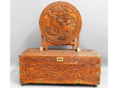 An early 20thC. carved camphor wood chest with bra