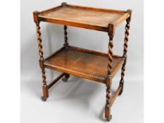 A 1920's oak barley twist tea trolley, 24in wide x