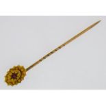 A 9ct gold tie pin set with ruby, 51mm long, 1.1g