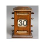 An early 20thC. perpetual calendar, 8.5in tall