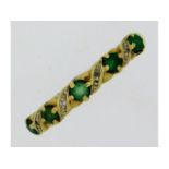 A 9ct gold ring set with emerald & diamond, stones