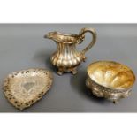 A silver plated creamer, an Asian silver sugar bowl & an Asian silver trinket dish, both tested 149.