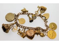 A 9ct gold charm bracelet including a 22ct gold ha