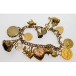 A 9ct gold charm bracelet including a 22ct gold ha