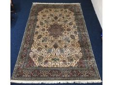 A hand knotted Isfahan silk rug, 275cm x 185cm, co