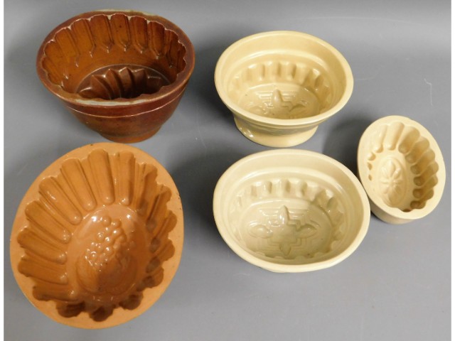 Five Victorian stoneware jelly moulds, three with