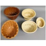 Five Victorian stoneware jelly moulds, three with
