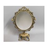 A decorative brass mirror, 19.25in high