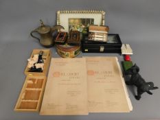 Two Hillcourt Estate catalogues, a dog doorstop, a Dallah pot, vintage tins & other sundries