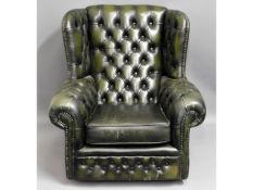 A leather button back Chesterfield armchair, 35in