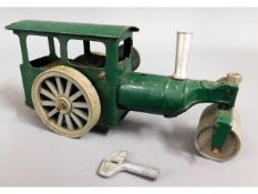 A tin plate clockwork steam roller, working order