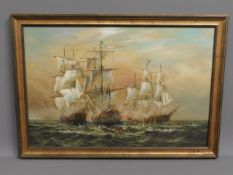 A framed oil on canvas of galleons in battle, indi