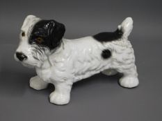 A heavy, solid porcelain model of black & white te
