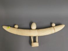 An early 20thC. worked African ivory tusk, 18in lo