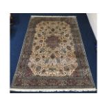 A hand knotted Isfahan silk rug, 275cm x 185cm, co