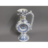 A late 19thC. delft faience puzzle jug, 10in tall
