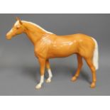 A large Beswick palomino horse, 11in tall